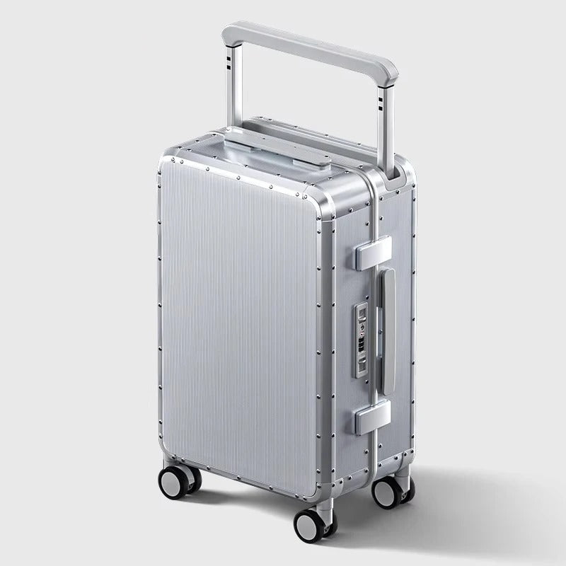 Silver suitcase with wheels and handle on a light gray background