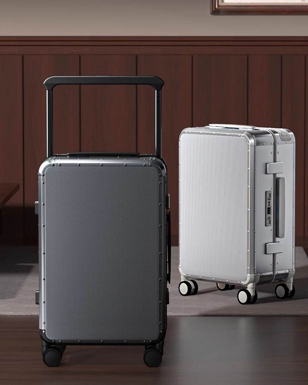 Two silver suitcases on a wooden floor with a wooden wall background