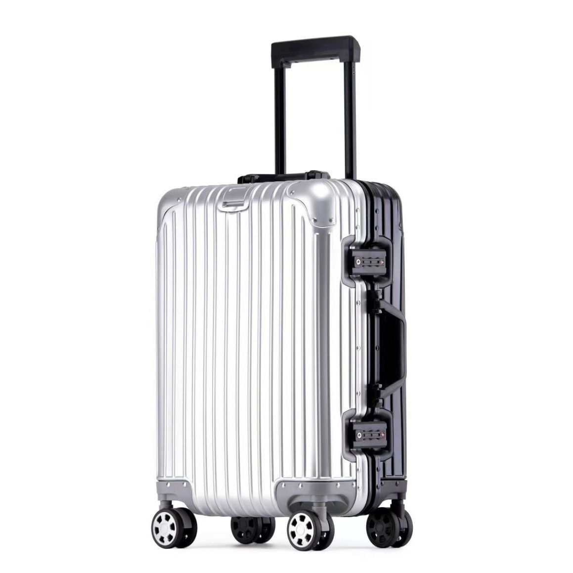Silver suitcase with black handle and wheels on a white background