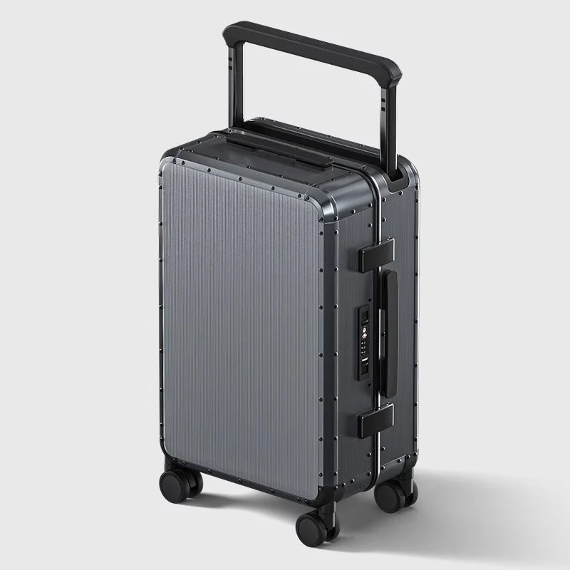 Silver suitcase with black handle and wheels on a light gray background
